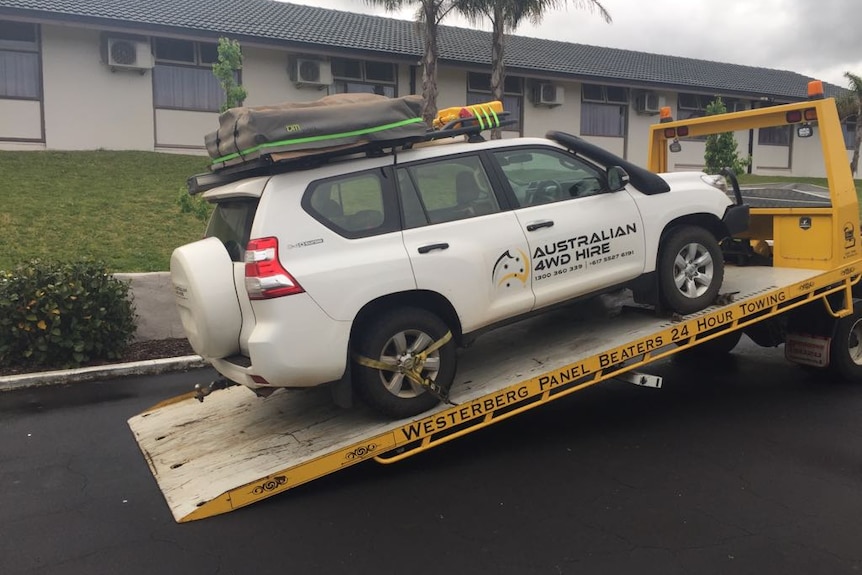 An Australian 4WD Hire car being loaded onto a tow truck