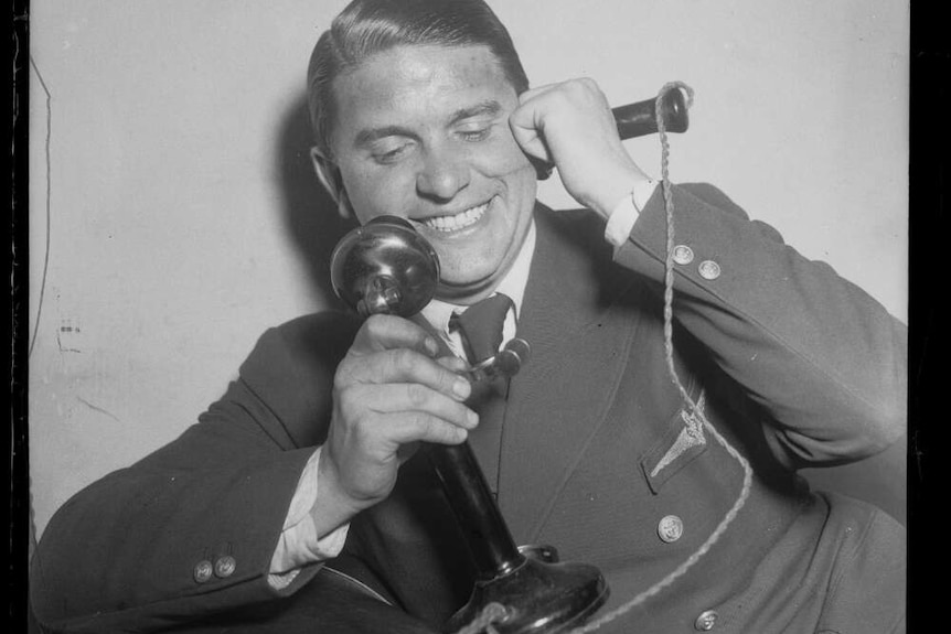 Aviator Captain Hans Bertram talking on the telephone, New South Wales, 26 October 1932.