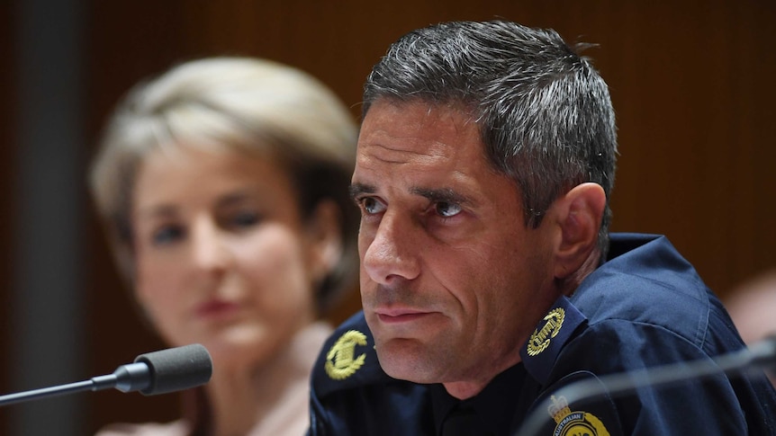 Roman Quadvlieg purses his lips with a neutral expression at a 2015 senate estimates session.