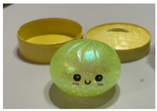 A squishy yellow dumpling toy.