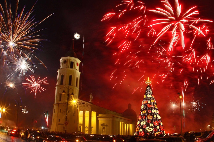 Fireworks light up the sky above the Cathedral Square in Vilnius, Lithuania.