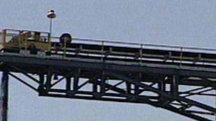 Coal falling from conveyor belt into heap at an Australian coal mine