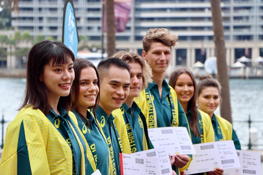 Group of diving athletes with their tickets to the Tokyo Olympic Games
