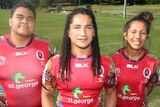 Proud heritage ... Saia Fainga'a (C) shows off the Reds' Indigenous Round jersey alongside Paul Cobbo (L) and Tallisha Harden