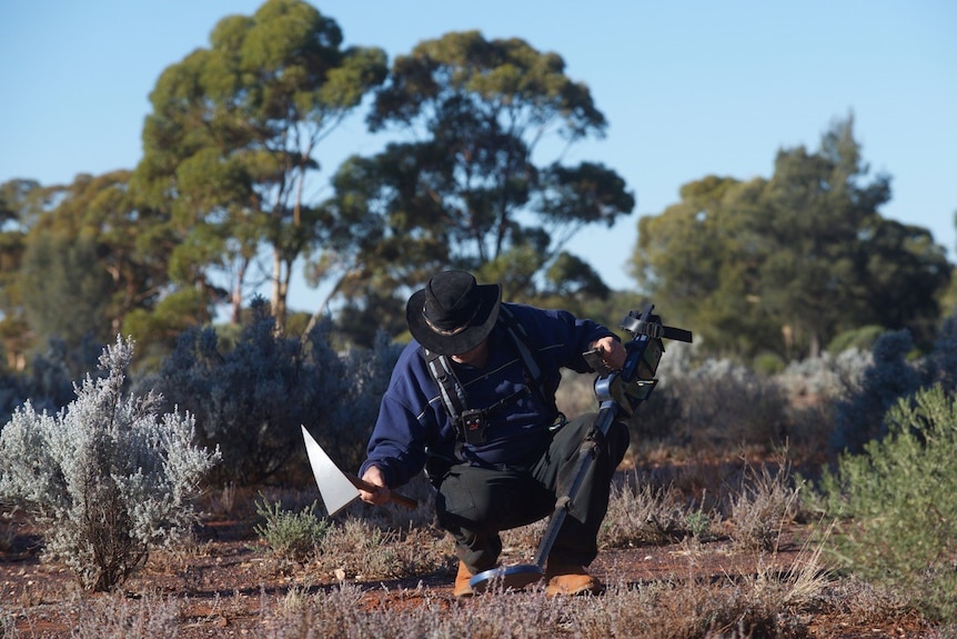 A gold prospector works in the WA Goldfields.