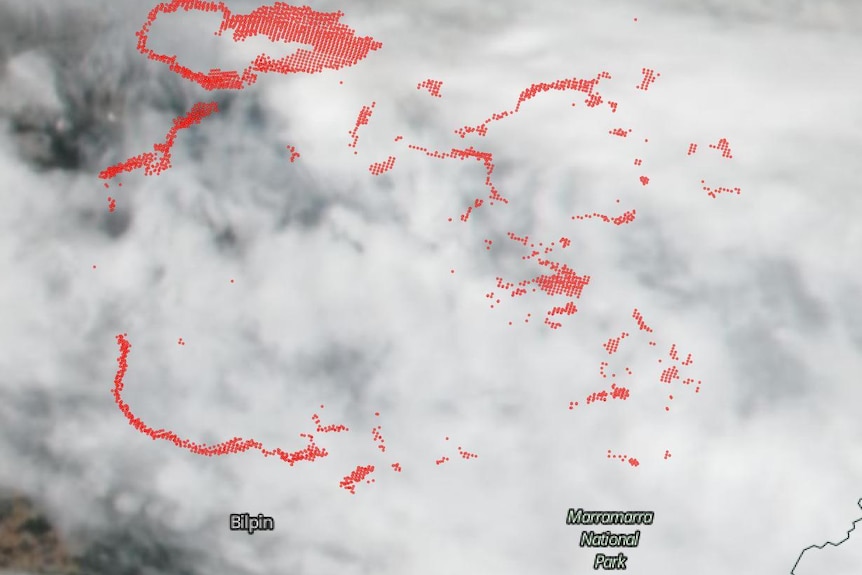 a smoky and cloudy map with red spots