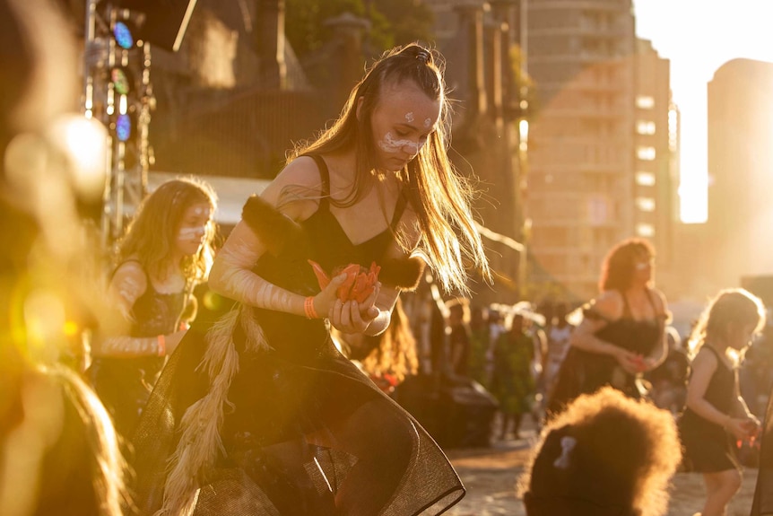 Colour photo of Wagana Dancers performing at sun down at Dance Rites 2018.