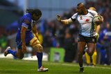 On the fly ... Marika Koroibete (R) looks to fend off Samoa's Iosia Soliola