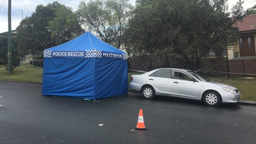 A police tent on the side of the road.