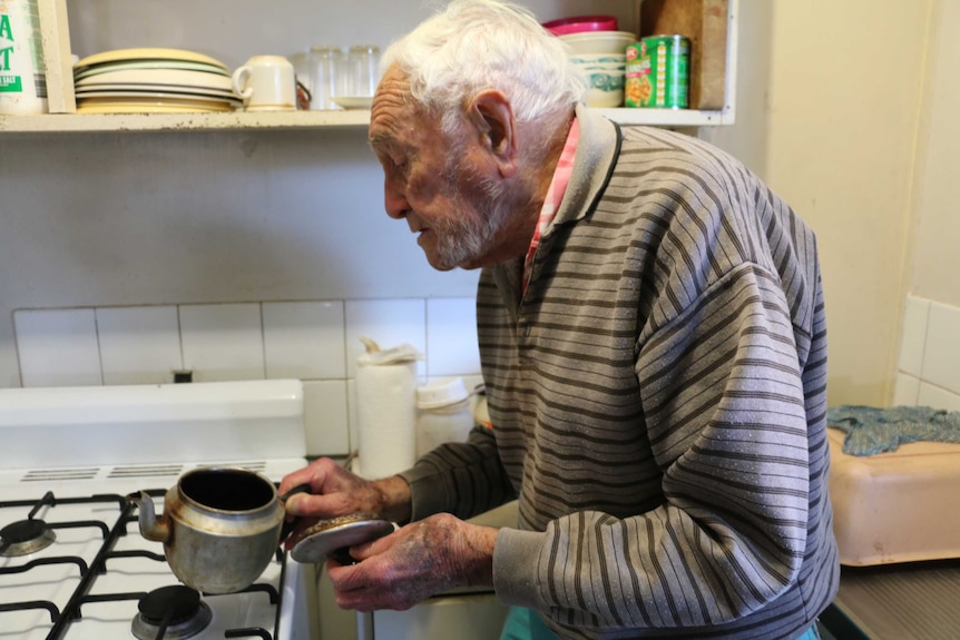 David Goodall makes a cup of tea at his flat