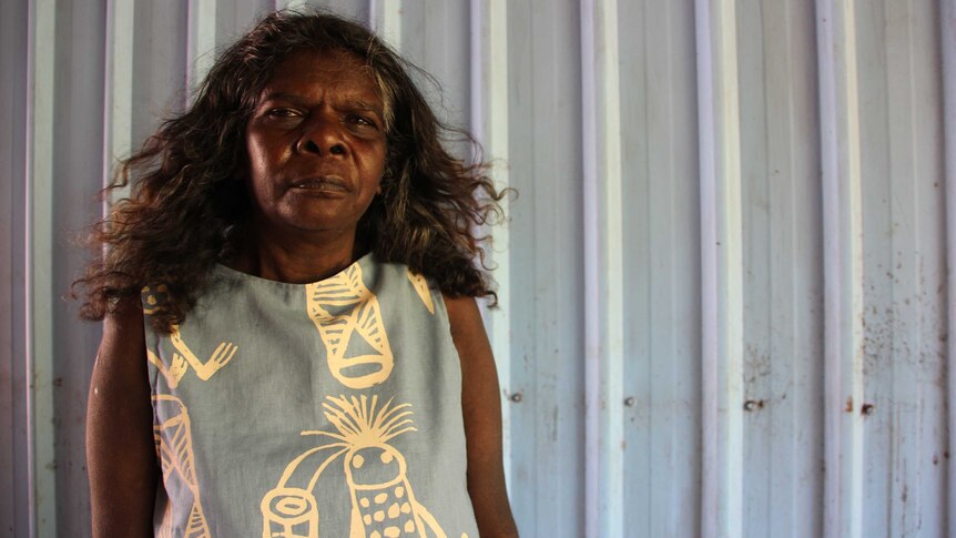 Lucy Yarawanga wearing a top with an Aboriginal design.