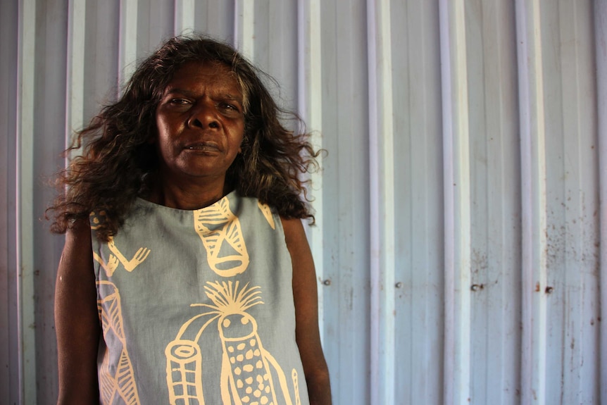 Lucy Yarawanga wearing a top with an Aboriginal design.