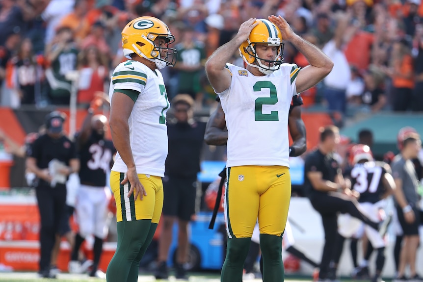 Mason Crosby stands with his hands on his head