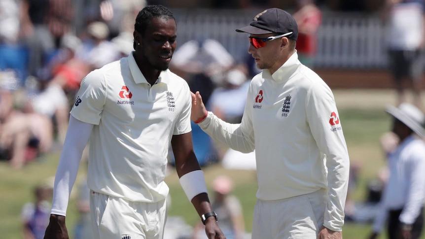 England cricket captain Joe Root talks to fast bowler Jofra Archer