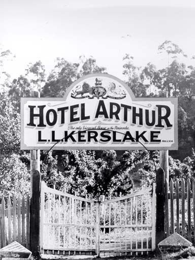 A black and white photo of gates and a sign emblazoned with 'Hotel Arthur L.L. Kerslake' at Port Arthur, Tasmania
