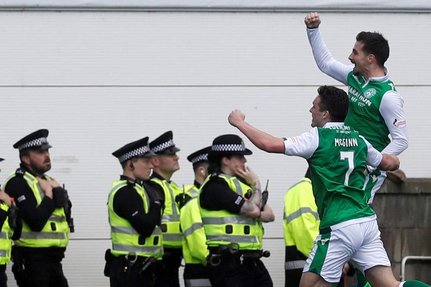 Hibernian's Jamie Maclaren celebrates scoring against Celtic on April 21, 2018.