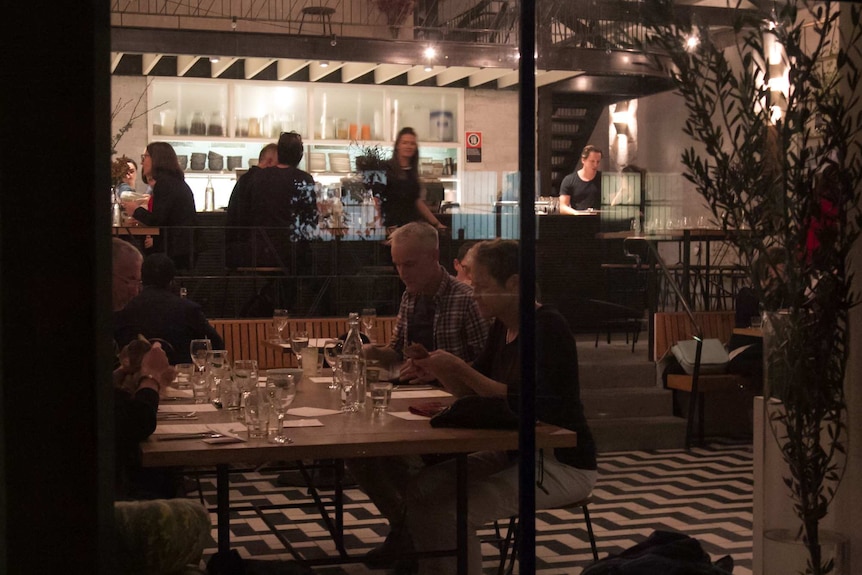 Patrons sit inside the Mecca cafe in Alexandria