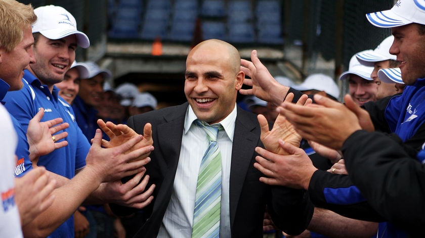 Living legend... Hazem El Masri is mobbed by his team-mates at Bulldogs HQ.