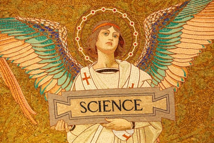 Image of an angel holding a placard with the word 'science' on it