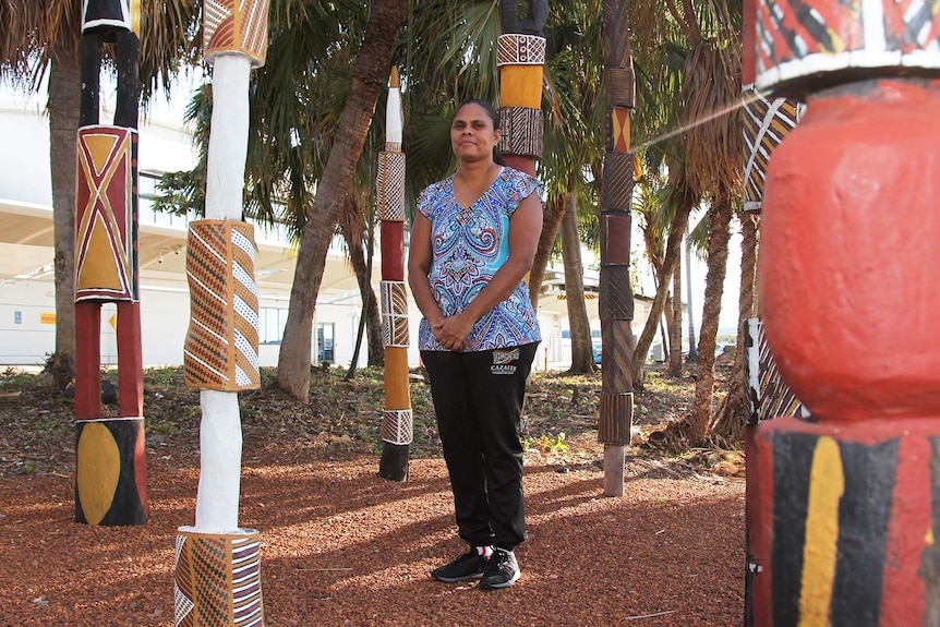 Jennifer Coombes with Pukumani Poles