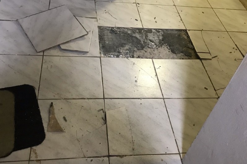 Cracks in the floor, as captured by a resident.