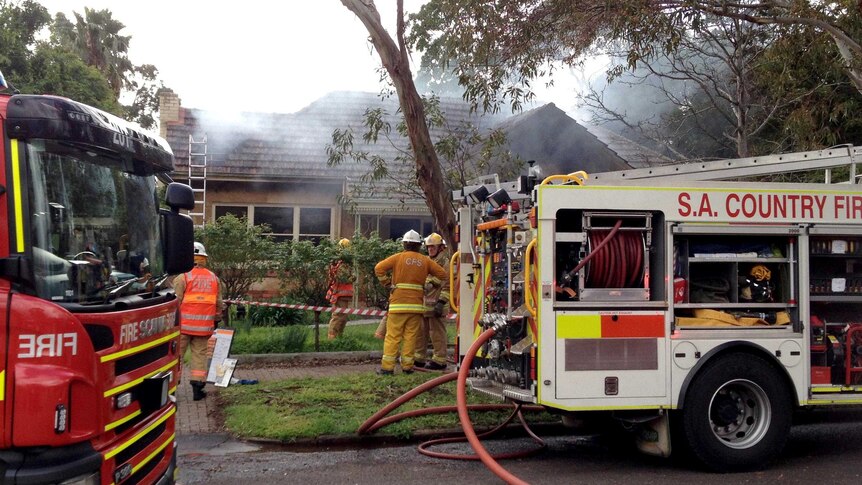 Firefighters battle a house fire in the Adelaide suburb of Linden Park.
