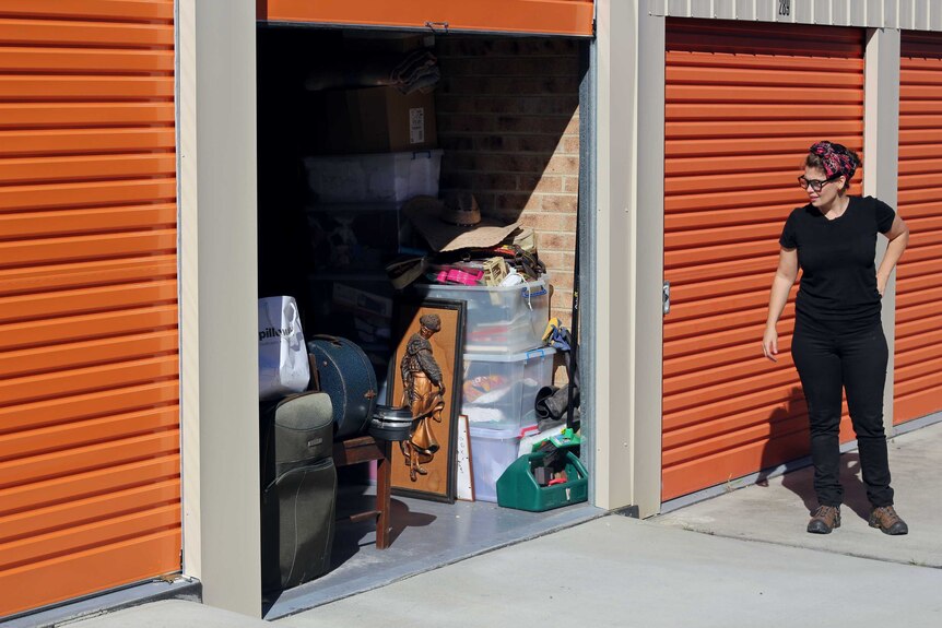 Ilona Harker looks at her possessions stacked into a Ballina storage unit