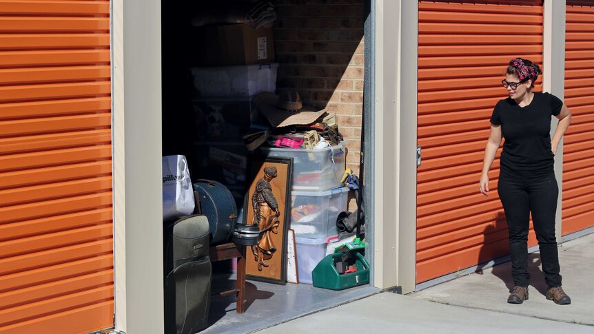 Ilona Harker looks at her possessions stacked into a Ballina storage unit