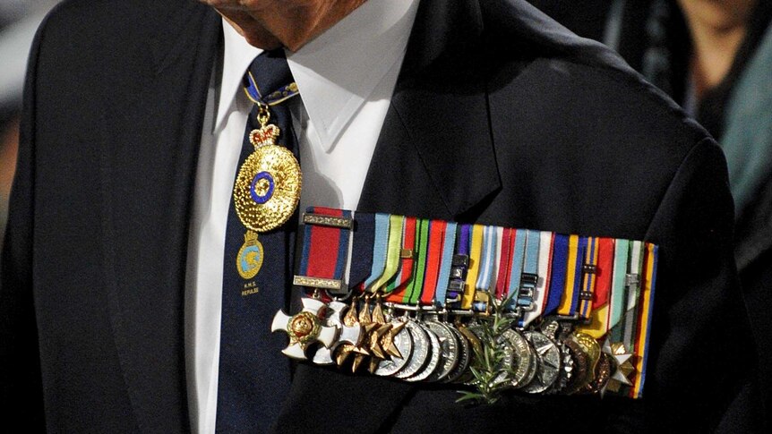 An ex-serviceman wears his medals at the Anzac Day dawn service in Sydney.