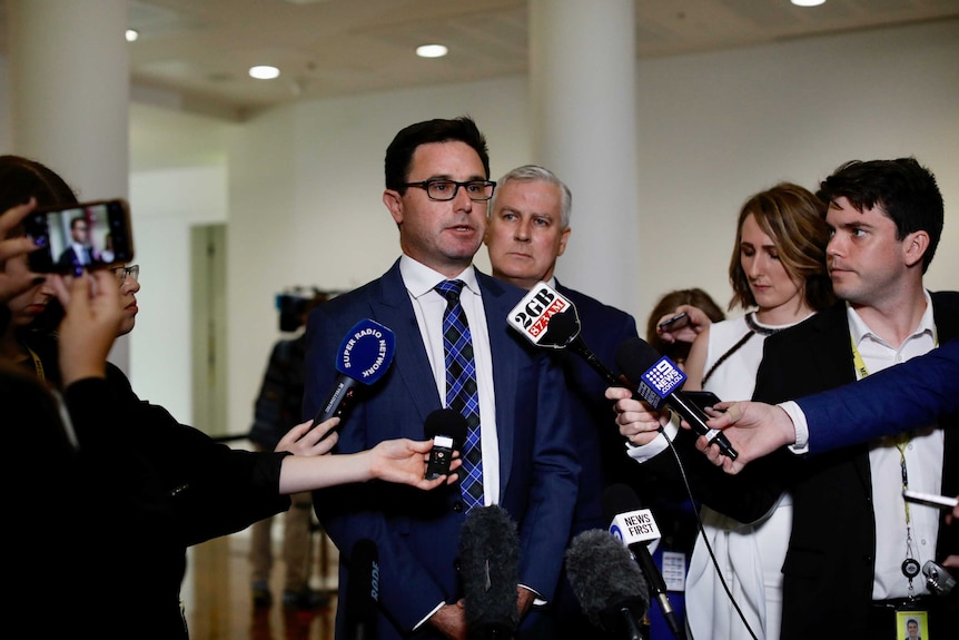 David Littlepround addresses the media, while Michael McCormack looks over his shoulder