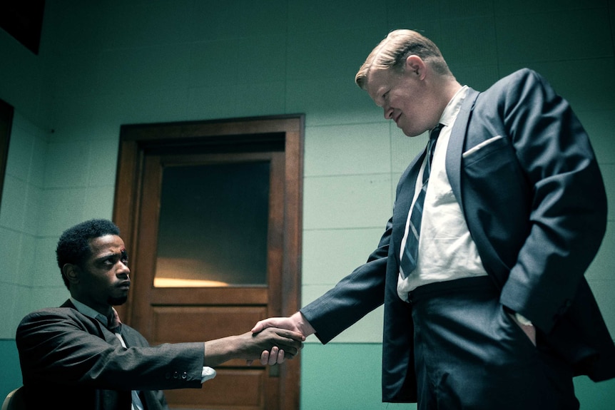 Actors Lakeith Stanfield and Jesse Plemons in an interrogation room in the film Judas and the Black Messiah