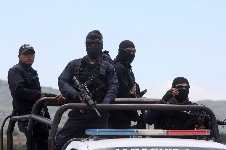 Mexico federal police leave scene of gunfight