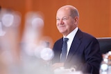 German Chancellor Olaf Scholz smiling. 