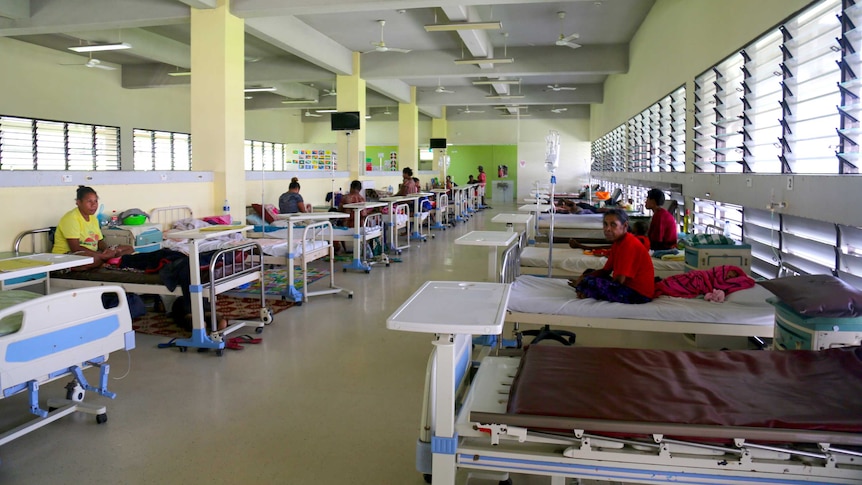 A ward in Port Moresby Hospital with women on beds