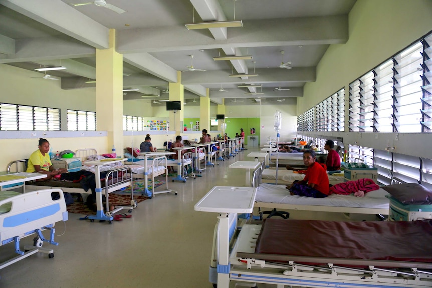 A ward in Port Moresby Hospital with women on beds