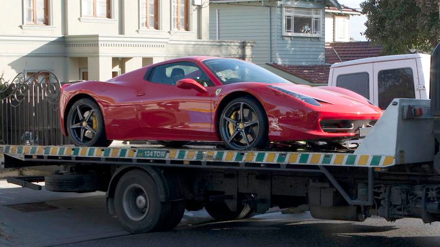 Police seize a Ferrari from the Balwyn home of Bobby Singh.