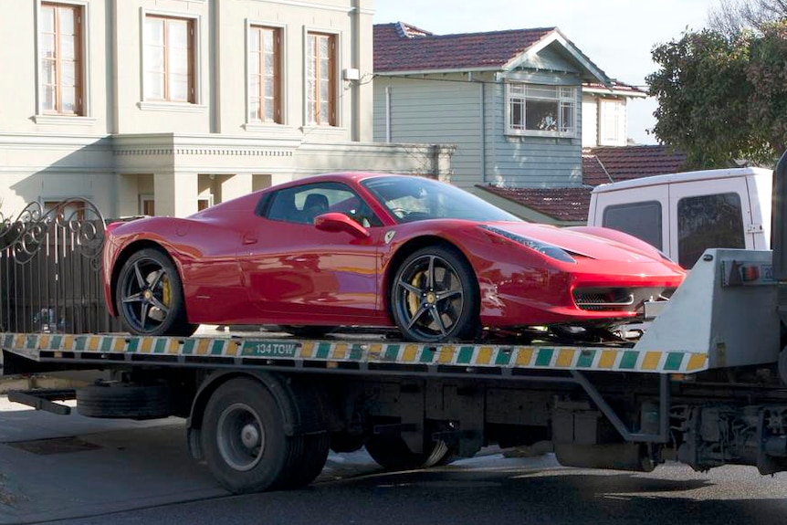 Police seize a Ferrari from the Balwyn home of Bobby Singh.