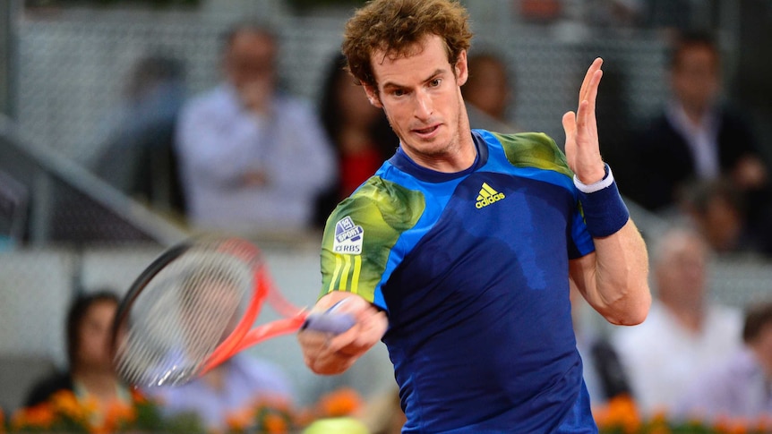 Andy Murray plays a shot against Tomas Berdych at the Madrid masters