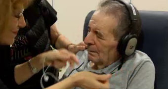 Dementia patient with headphones on