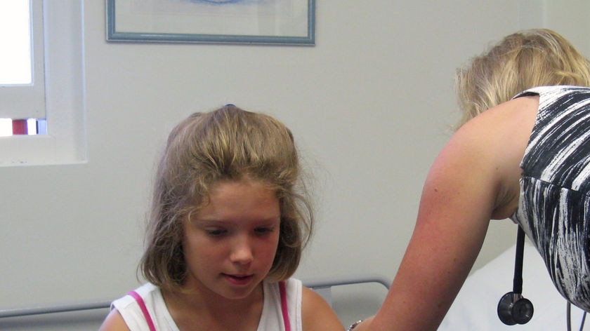 A girl is injected with a diluted dose of venom from a jack jumper ant.