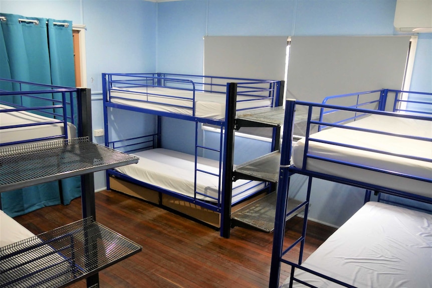 empty bunk beds in a backpacker hostel
