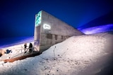 Two people standing at the arctic vault in Norway.