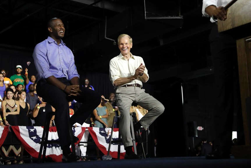 Democratic gubernatorial candidate Andrew Gillum sits with US senator Bill Nelson.