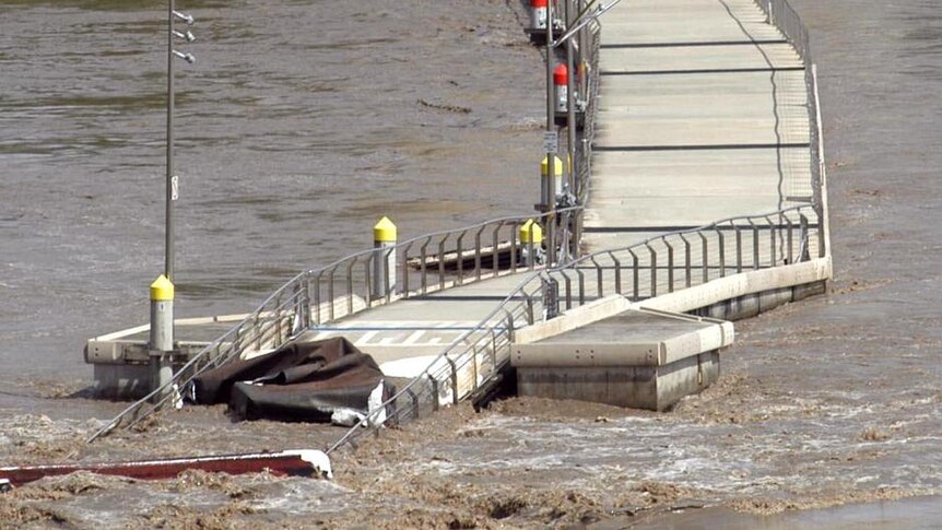 The floating walkway along the Brisbane River between the CBD and New Farm lies in ruins on January 12, 2011 after the flood.