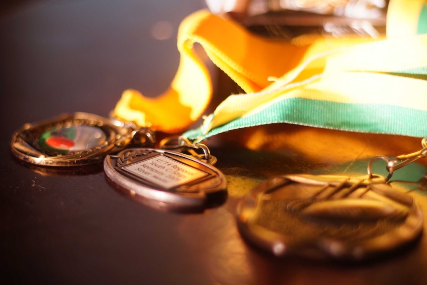 Baseball medals on a table.