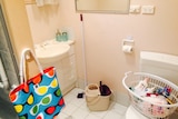 Cleaning items and toiletries placed in the bathroom for families to use once they move in.