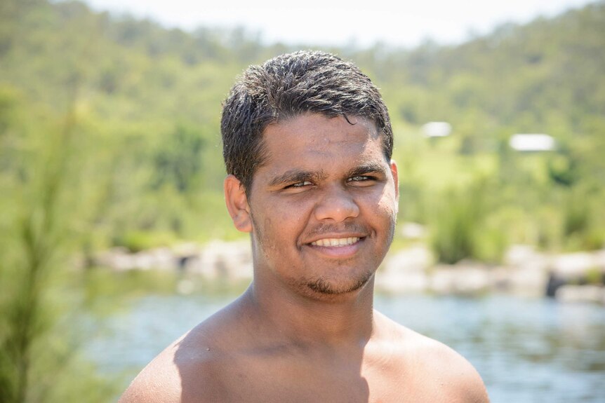 Bundjalung teenager Trent McGrady teaches younger boys how to dive for turtles