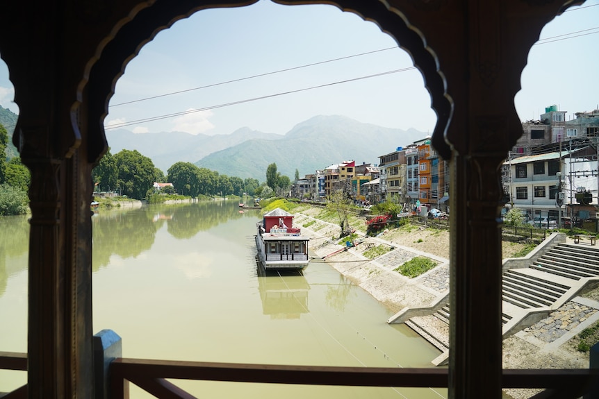 A bridge with ornate arches overlooks Dal Lake in Srinagar