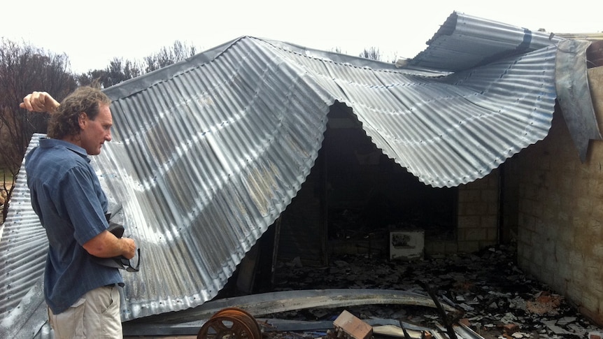 Tim Moore outside his destroyed home in Prevelly