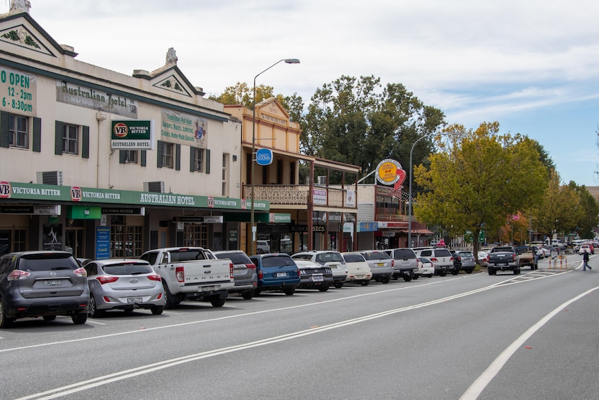 A streetscape with cars.